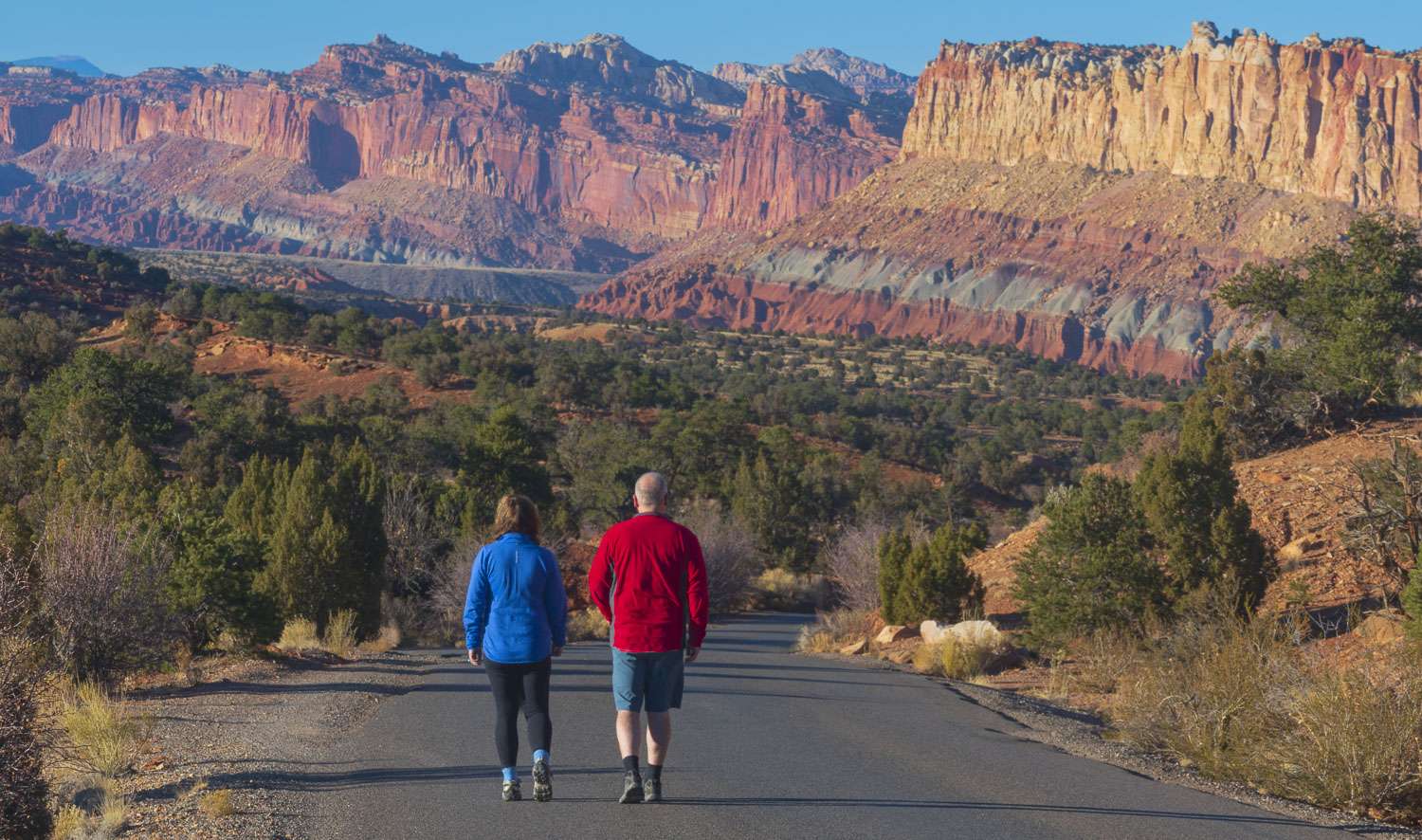 capital-reef-national-park Missy and Brent walking on road at Capital Reef national Park in Utah.