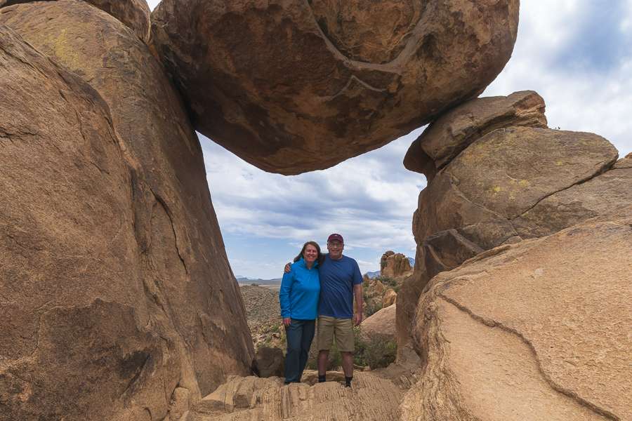 tx-big-bend-balanced-rock Missy and Brent with big boulder overhead standing at Balanced Rock at Big Bend National Park