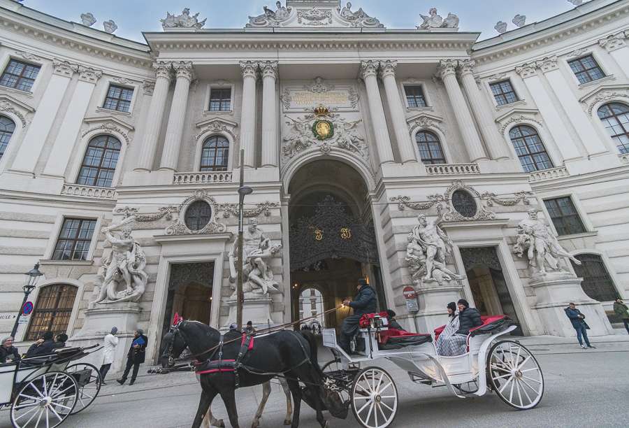 Horse and carriage on Michaelerplatz at Hofburg Palace in Vienna